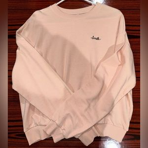 light pink sweater